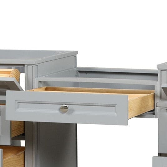 Kensington 23 inch bridge drawer in Metal Gray, shown between two vanities